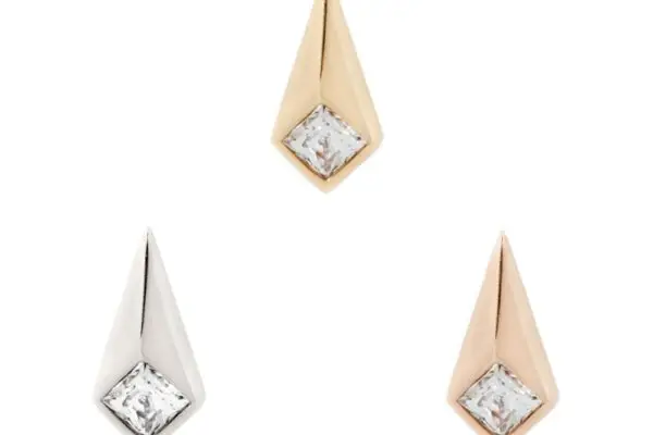 The 14K Chelsea stud earrings feature a pointed teardrop design with square clear gemstones, available in gold, rose gold, and silver tones for an elegant geometric look.