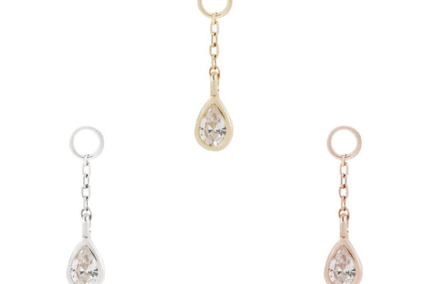 The 14K Concorde - Chain + Charm features three teardrop-shaped crystal charms on gold, silver, and rose gold chain links, displayed on a white background.