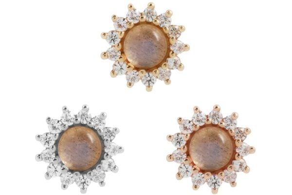 Three round stud earrings featuring central labradorite stones surrounded by white sapphires. Two have a 14K Delphine gold end, and one has a silver-toned setting. All are displayed on a white background. Product: 14K DELPHINE - LABRADORITE + WHITE SAPPHIRE.