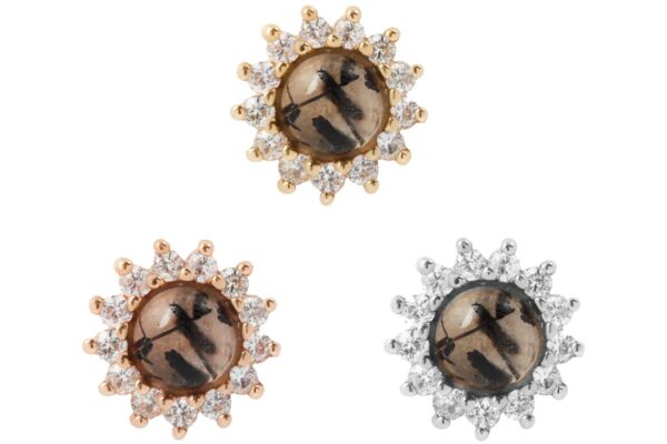 Three round 14K Delphine - Tourmalated Quartz + White Sapphire earrings, featuring a dark, marbled center stone with a clear white sapphire halo; two are gold-set and one is silver-set, arranged on a white background.