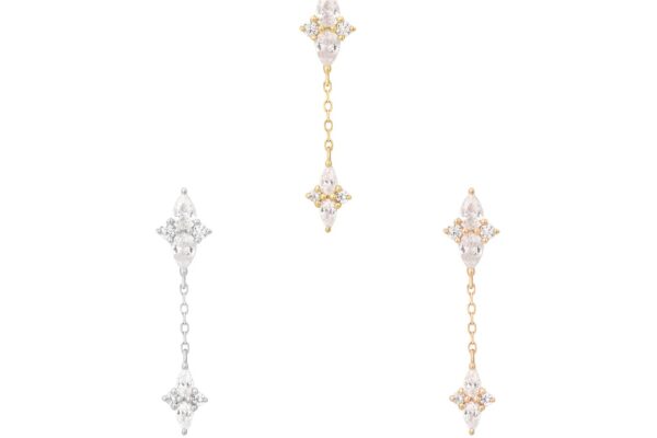 Three pairs of 14K Ethereal Remix - Dangle earrings: one in silver, one in gold on the right, and a mixed gold-silver pair in the center. Each drop earring showcases small round Cz dangle gemstones and a diamond-shaped design.