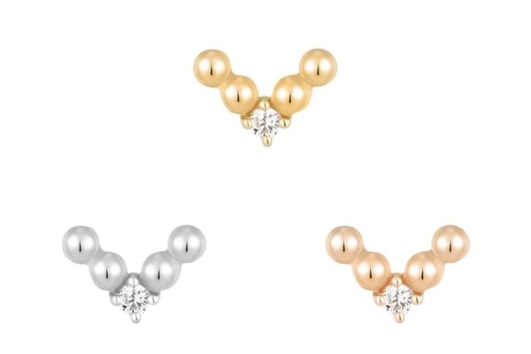 Three small v-shaped earrings with three round beads each—one in silver, one in gold, and one in 14K Voodoo rose gold—each tipped with a tiny diamond-like stone.