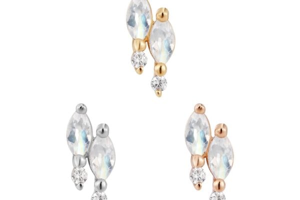 The Dreamland - Rainbow Moonstone - Threadless End features a marquise-cut rainbow moonstone and a round clear gem, crafted in gold, silver, and rose gold tones, all neatly arranged on a white background.