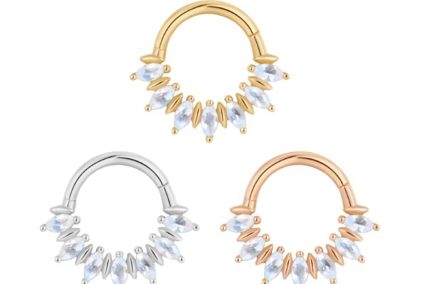 Three 14K Purpose - Clicker septum rings in gold, silver, and rose gold tones are displayed on a white background, each featuring a row of marquise-cut clear crystals.