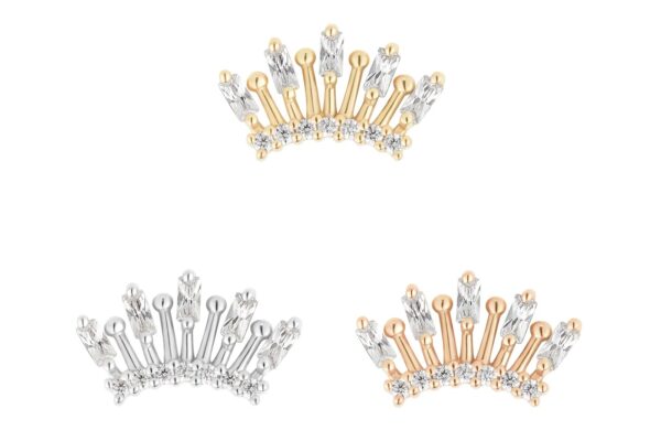 Three 14K Holiday earring jackets are featured: silver with clear crystals, gold with clear crystals, and silver with a unique crystal layout. Each showcases a curved, spiked crown design for a striking statement look.