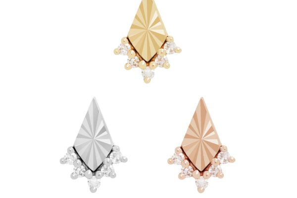 Three geometric stud earrings in gold, silver, and rose gold tones, each shaped like a diamond with a textured surface and small pearl accents—a modern interpretation of the 14K Glow - Diamond style.