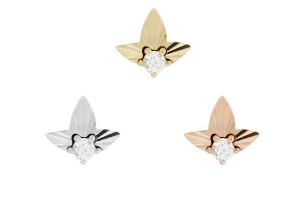 Three leaf-shaped stud earrings in a triangle: one in 14K Gratitude Gold End, one in silver, and one in rose gold. Each stud has a single round white gemstone at its center, displayed against a plain white background.