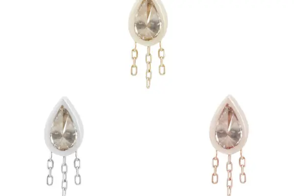 The 14K Let's Dance earrings feature three teardrop-shaped crystals, each with three dangling chains in gold, silver, and rose gold finishes, elegantly displayed against a plain white background.