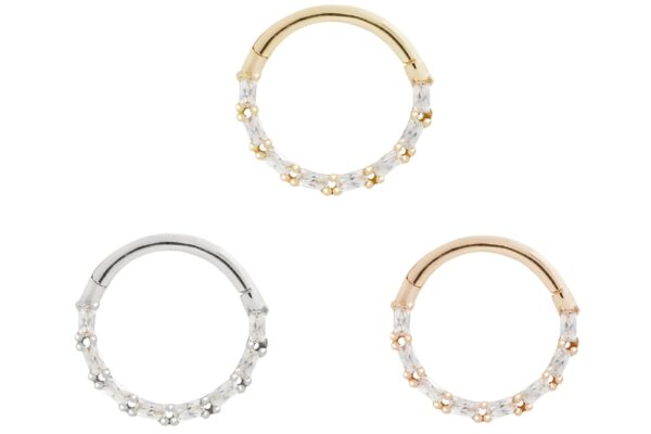 Three 14K Loved - Clicker circular hoop earrings, each with small white gemstones along half the hoop, are shown in gold, rose gold, and silver, all displayed on a white background.