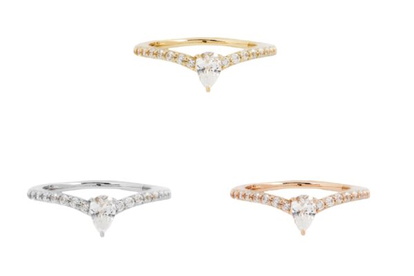 Three 14K Nyx - Clicker rings with pear-shaped diamonds and pavé bands in yellow, white, and rose gold are showcased on a white background, highlighting their elegant design.