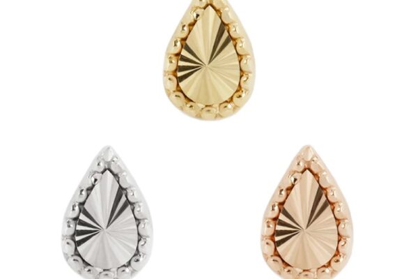 The 14K Stay Gold studs come in gold, silver, and rose gold, each featuring a teardrop shape with a textured sunburst center and beaded border.