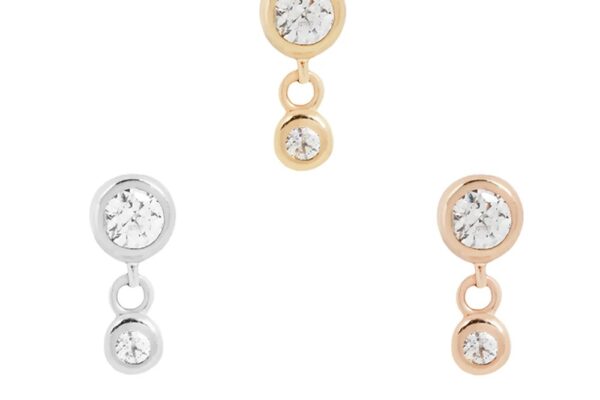 Three pairs of 14K Sutton stud earrings with sparkling Cz End gemstones in gold, silver, and rose gold. Each pair features a large stone above a smaller dangling one, all elegantly displayed on a white background.