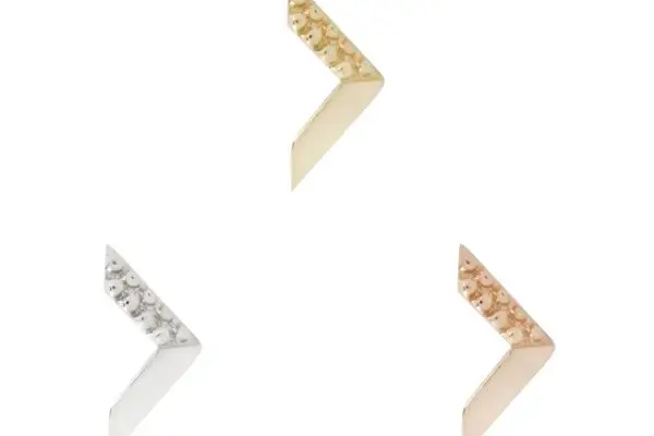 Three metallic chevron earrings from the 14K Vortex collection—in gold, silver, and rose gold—are arranged in a triangle on a white background. Each earring features a textured, dotted surface for an elegant touch.