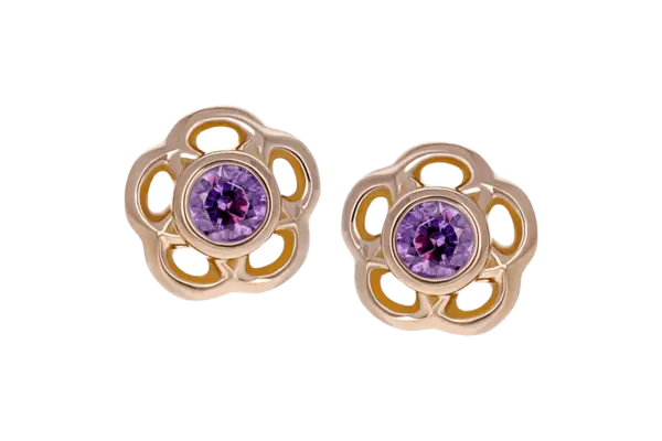 A pair of 18k Tama End stud earrings with an openwork floral design, each adorned with a central round purple gemstone.