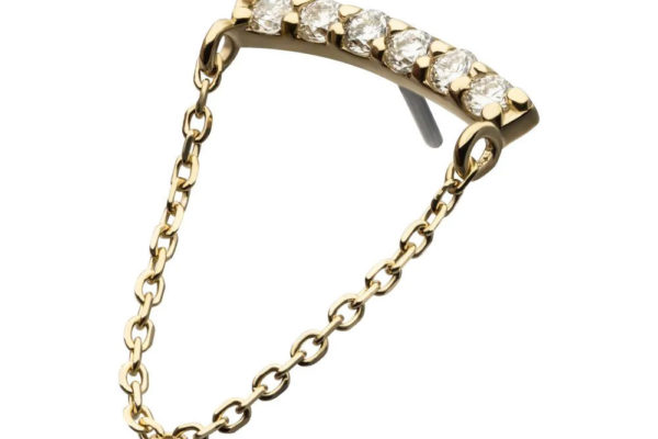 The 14K Curved Bar Dangle - Diamond features six round white diamonds on a curved gold bar, accented by a delicate gold chain at both ends, set against a white background.