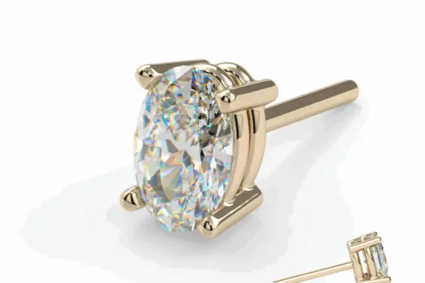 The 14K Oval Prong stud earring features a large oval-cut diamond held by four prongs, shown against a white background with a smaller inset of the side view in the lower right corner.