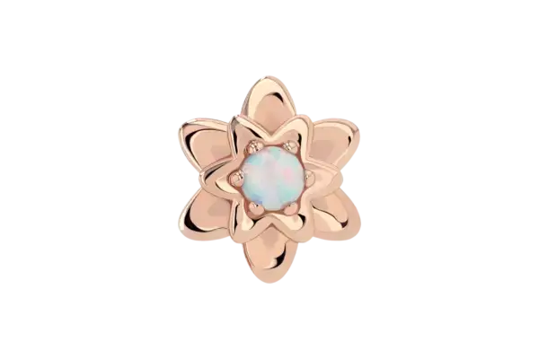 The 18k Petaluma End is a rose gold flower-shaped ring with overlapping petals, featuring a central round opal and small accent stones, shown on a white background.