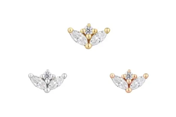 The 14K Pur stud earrings feature a floral design with three marquise clear stones and a round center gem, available in gold, silver, and rose gold tones—all beautifully displayed on a white background.