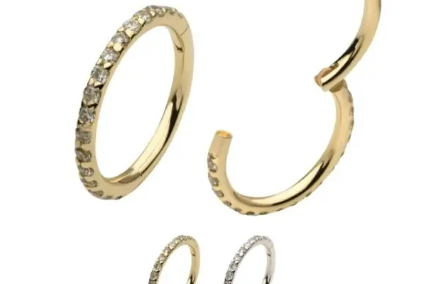 A set of four 14K Eternity Side Clicker - Diamond rings in yellow and white gold, each with lab-grown diamonds adorning one side. The "Lab Grown Diamonds 14K Gold" logo is displayed at the top left.