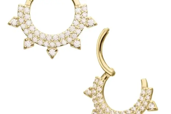 The 14K Double Gem Spiked Clicker features gold hoops with small white round gemstones and triangular sunburst accents along the bottom edge. One earring is shown closed, the other open.