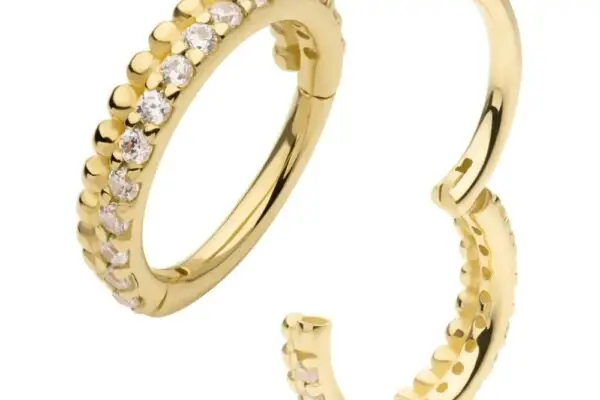 The 14K Bead & Gem Side Clicker showcases gold hoops, each with a row of clear gemstones along the outer edge. One earring is shown open, the other closed.