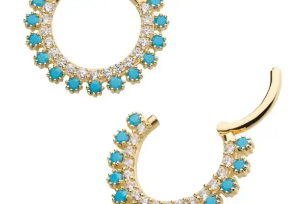 The 14K Double Row Clicker - Turquoise features gold hoop earrings with alternating turquoise stones and clear white crystals in a half-moon pattern along the bottom edge of each hoop.