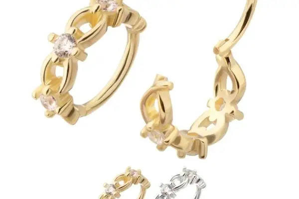 Four delicate hoop earrings—three gold, one silver—each showcase intricate floral designs and round gemstones on a white background. One gold hoop features the 14K Side Braid Clicker detail.