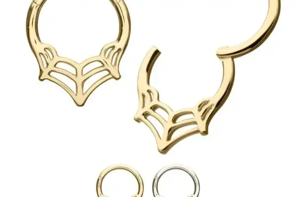 Two pairs of 14K Spider Web Clicker hoop earrings, one gold and one silver. A gold earring shows its clasp open, while the other earrings remain closed.