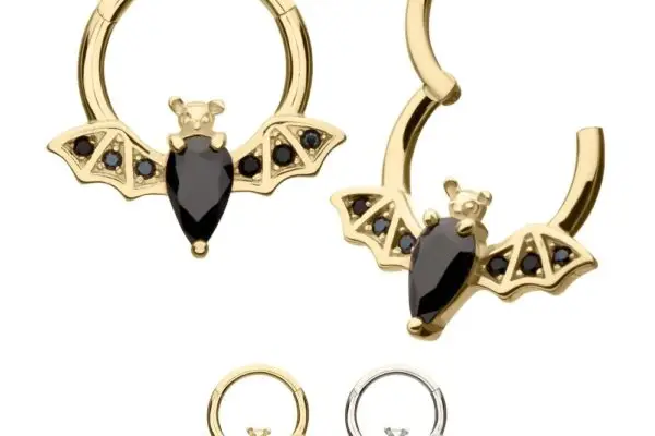 Four 14K Flying Bat Clicker hoop earrings, each with bat shapes in gold and silver finishes and black gemstone accents, are arranged side by side on a white background.