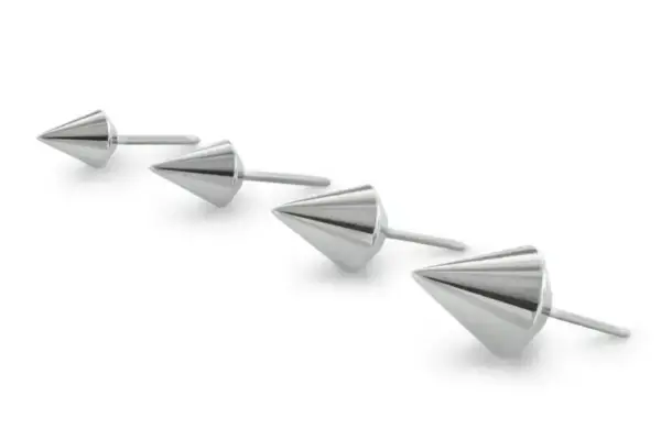 Four cone-shaped metallic Spears studs with flat circular bases are arranged in a row on a white background, all facing the same direction.
