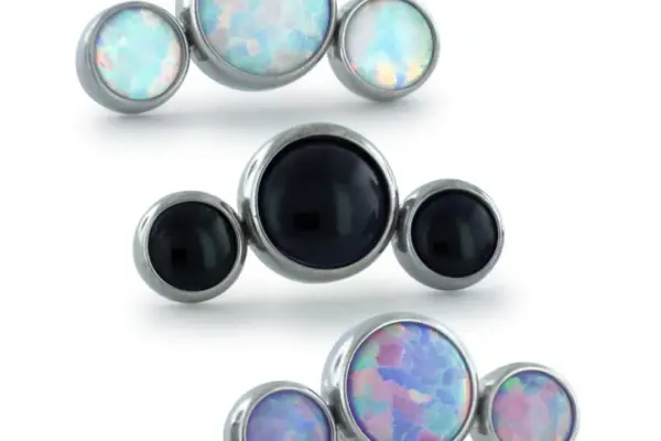 Three sets of Bezel Set Cabochon Cluster - Curved earrings with silver edges: top set features iridescent blue opal, middle set has solid black stones, and bottom set includes iridescent pinkish-purple opal.