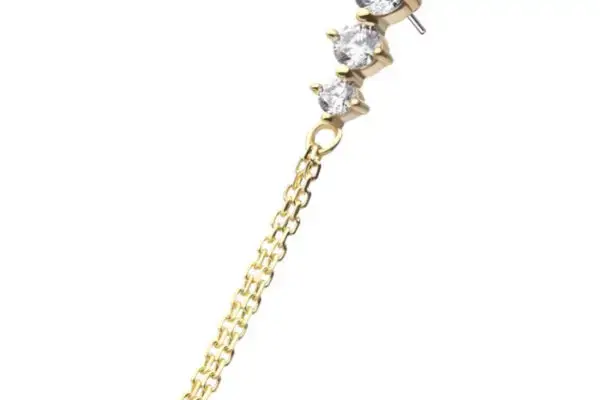 The 14K 3 Graduated - Dangle earring features three round, clear gemstones in a vertical row and a delicate gold chain gracefully hanging from the bottom.