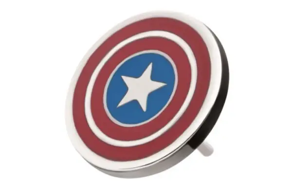 The Captain America Shield - Marvel is a round pin with red and white concentric circles, a blue center, and a white star—just like Captain America’s shield—shown on a white background.