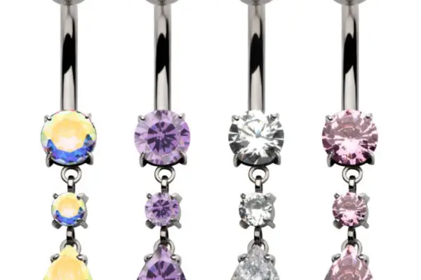 Four Double Dangle Navel Curve belly button rings, each featuring three dangling gemstones in round and teardrop shapes with iridescent, purple, clear, and pink tones, are displayed vertically on a white background.