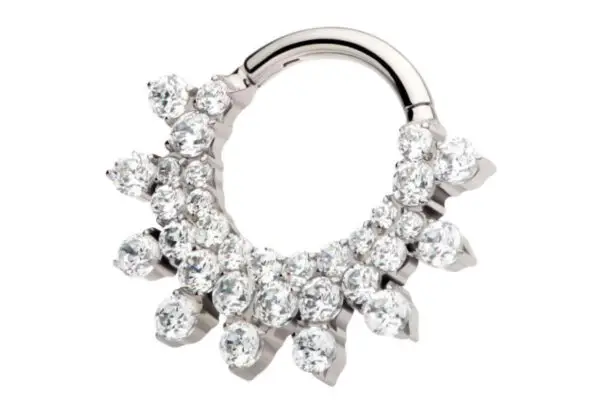 A circular silver 9 Spike Gem Clicker earring features clusters of round, sparkling clear gemstones arranged in a bold sunburst pattern along the lower half.