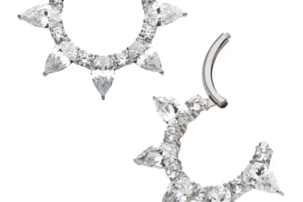 Two silver 5 Teardrop Clicker hoop earrings feature alternating round and teardrop-shaped clear gemstones in a sunburst pattern; one earring is shown closed, the other open.