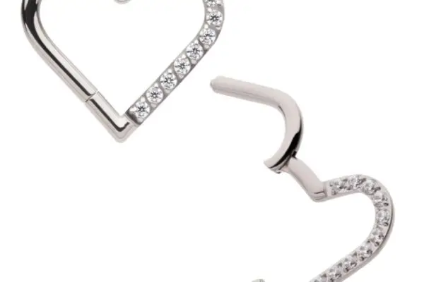 Two Heart Clicker - L earrings in silver titanium, each partially open, feature small sparkling white stones along one side of the heart and are displayed on a plain white background.