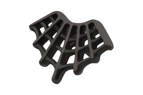 The Black Spiderweb is a black plastic soap dish featuring a modern fan-like spider web design with open slats for drainage, shown against a white background.