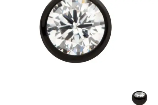 A round clear gemstone is set in the Black Bezel, with a straight post behind it, shown up close and in full view on a white background.