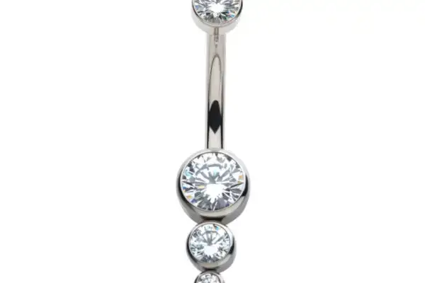 The 3 Drop Cluster Navel is a belly button ring with a silver titanium curved barbell and four clear round gemstones of different sizes arranged vertically in a cluster.