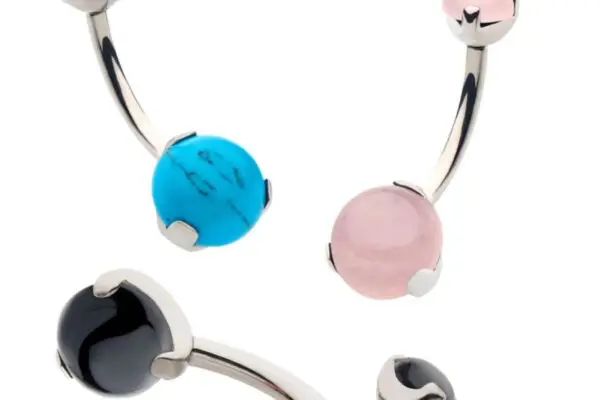 Three Double Stone Prong curved barbells with gemstone ends are shown: one with turquoise blue, one with light pink, and one with black stones. One black gemstone end is unscrewed to show the internal threading.