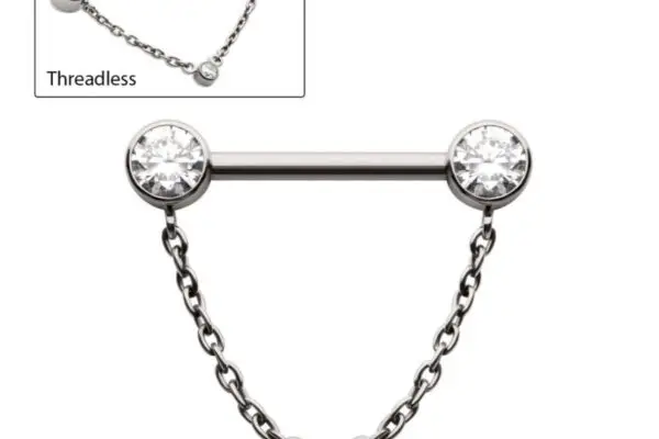The Bezel Gem Dangle Chain is a silver barbell piercing with clear bezel gem ends and a center gem on a dangle chain. The inset displays the threadless bar and chain separately.