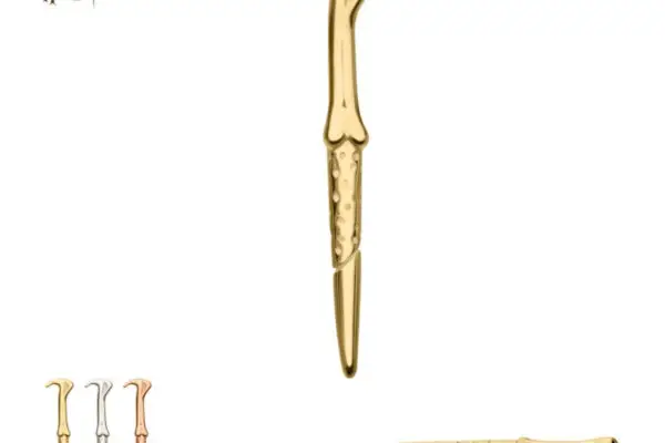 A gold-colored pin shaped like the 14K Lord Voldemorts Wand from Harry Potter, featuring a snake head handle, is shown with silver and bronze versions plus a side view. The Harry Potter logo appears in the top left corner.