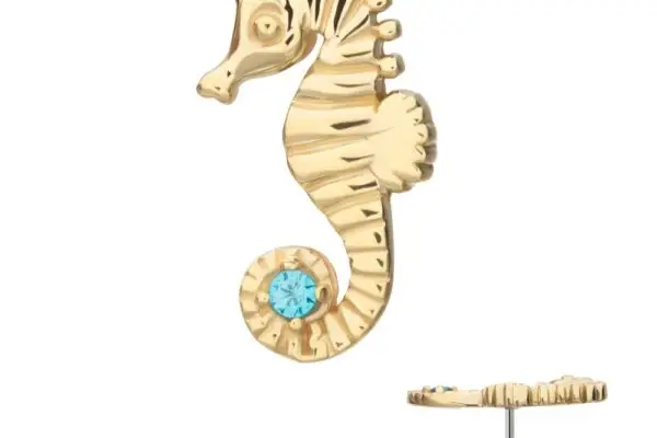 The 14K Seahorse, a gold earring with a blue gemstone on its curled tail, is shown from the front and side against a white background.