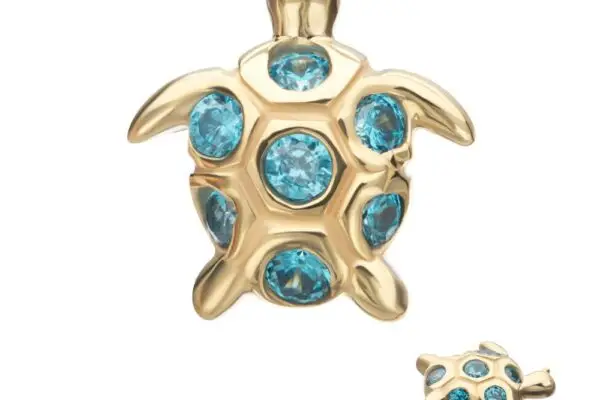 The 14K 2D Sea Turtle earring stud features six round blue gemstones on its shell and includes a smaller inset showing the back and earring post.