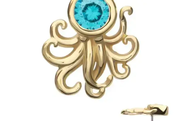 The 14K Octopus is a gold earring stud shaped like an octopus, featuring a bright blue gemstone center, with an extra view showing the post and backing.