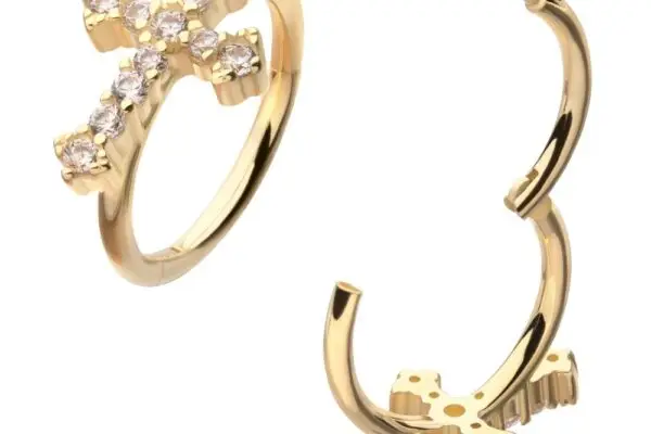 Two 14K Antique Cross - Clicker gold rings, each decorated with small clear gemstones, are shown from different angles on a white background.