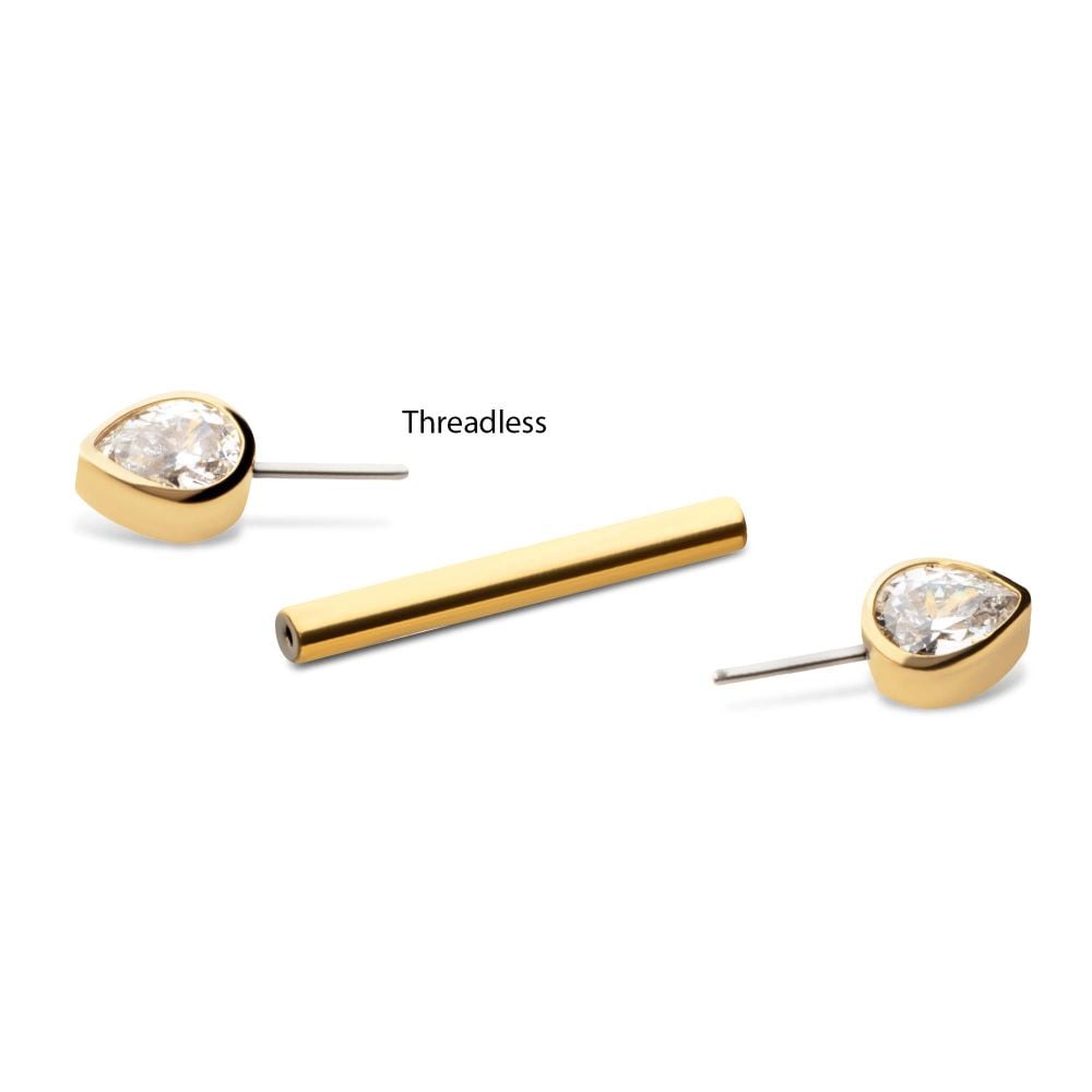 The Teardrop Nipple Barbell, featuring two gold earrings with teardrop-shaped clear stones and a separate gold cylindrical bar labeled “Threadless,” is displayed on a white background.