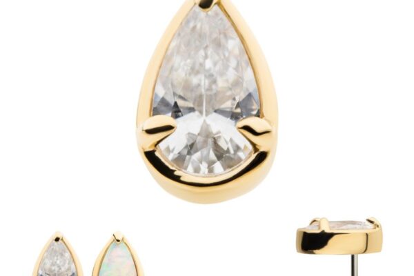 The 14k Pear Prong features a pear-shaped clear gemstone in a bezel setting, secured by two prongs at the bottom. Shown from the front, side, and next to an opal version for comparison.
