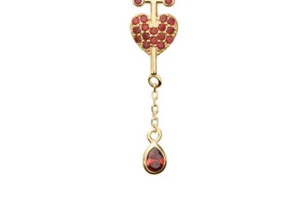 The 14K Dagger Heart & Teardrop Chain Dangle gold earring features a cross and heart with red stones and a dangling teardrop-shaped red gem, shown from the front and side on a white background.